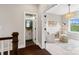 Hallway that transitions to the sitting room and a powder room, creating a welcoming and functional space at 2150 Paddlers Cove Dr, Clover, SC 29710