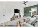 Cozy living room featuring a stylish accent wall, ceiling fan, modern furniture, and lots of natural light at 2150 Paddlers Cove Dr, Clover, SC 29710