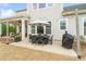 Outdoor patio seating area with overhead string lights and a grill, perfect for entertaining at 2150 Paddlers Cove Dr, Clover, SC 29710