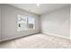 Bedroom featuring neutral carpet and windows, with a view of the neighborhood at 3041 Tramore Dr, Harrisburg, NC 28075