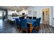 Dining room featuring a dark wood table and access to the bright, modern kitchen at 3100 Cheyney Park Dr, Charlotte, NC 28269