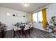 Bright dining space with yellow curtains, a round table, and modern flooring at 3100 Cheyney Park Dr, Charlotte, NC 28269