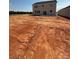 New home backyard under construction with a foundation at 317 Maidstone Dr # 57, Monroe, NC 28110