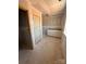 Unfinished bathroom featuring a sink cabinet, door and window ready for fixtures and personalization at 317 Maidstone Dr # 57, Monroe, NC 28110