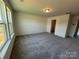 A carpeted bedroom with window and closet at 317 Maidstone Dr # 57, Monroe, NC 28110