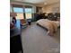 A modern bedroom with two windows, a dresser, and a basketball hoop at 317 Maidstone Dr # 57, Monroe, NC 28110