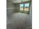 Bedroom with abundant natural light through two windows, a simple design and neutral palette at 317 Maidstone Dr # 57, Monroe, NC 28110