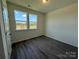Bedroom with wood-look flooring and natural light from windows at 317 Maidstone Dr # 57, Monroe, NC 28110