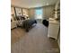 Stylized bedroom featuring carpeted floors, a metal-frame bed, art and comfortable furniture at 317 Maidstone Dr # 57, Monroe, NC 28110