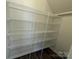 Walk-in closet featuring built-in wire shelving for ample storage at 317 Maidstone Dr # 57, Monroe, NC 28110