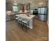 Modern kitchen featuring a large island, stainless steel appliances, and stylish countertops at 317 Maidstone Dr # 57, Monroe, NC 28110