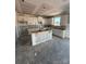 Unfinished kitchen space with white cabinets and an island ready for customization and appliances at 317 Maidstone Dr # 57, Monroe, NC 28110