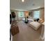 Bright living room with a large white couch, round coffee table, and lots of natural light at 317 Maidstone Dr # 57, Monroe, NC 28110
