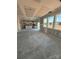Expansive open-concept space, featuring large windows and an unfinished kitchen with an island at 317 Maidstone Dr # 57, Monroe, NC 28110