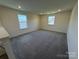 Upstairs loft space with windows providing natural light at 317 Maidstone Dr # 57, Monroe, NC 28110