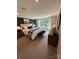 Main bedroom suite with a bed, an accent wall, carpet floors, a bench, and bedside tables at 317 Maidstone Dr # 57, Monroe, NC 28110