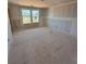 Unfinished room with window offering potential as a bedroom, office, or flexible living space at 317 Maidstone Dr # 57, Monroe, NC 28110