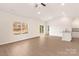 Bright living room with wood-look floors, ample natural light, and an open floor plan at 3246 Maple Ridge Dr, Gastonia, NC 28052