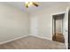 Bedroom with neutral carpet features closet and entry door at 325 East St, Heath Springs, SC 29058