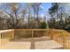 Wooden deck with railing, offering a view of the trees at 325 East St, Heath Springs, SC 29058