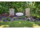 Stone pillar sign at the entrance of Stagecoach Station surrounded by lush greenery at 3319 Burberry Dr, Gastonia, NC 28052