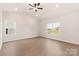 Bright bedroom with vaulted ceiling, fan, and views of the outdoors from two large windows at 3324 Burberry Dr, Gastonia, NC 28052