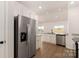 Stainless steel refrigerator accents granite countertops and white cabinets in this kitchen at 3324 Burberry Dr, Gastonia, NC 28052