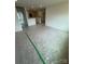 A large room with neutral walls, carpet and protective plastic flooring at 346 Knotty Wood Dr # 71, Monroe, NC 28110
