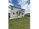 A beautiful backyard with a covered porch and green lawn, perfect for outdoor enjoyment at 346 Knotty Wood Dr # 71, Monroe, NC 28110