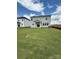 A spacious backyard with a covered patio, offering a relaxing outdoor space at 346 Knotty Wood Dr # 71, Monroe, NC 28110