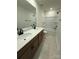 Bright bathroom with double sink vanity and tub with shower features at 346 Knotty Wood Dr # 71, Monroe, NC 28110