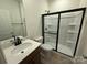 Modern bathroom features a black-framed glass shower and a sleek black faucet over a white vanity at 346 Knotty Wood Dr # 71, Monroe, NC 28110