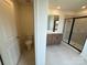 Bright bathroom with double vanity, framed mirror and sleek glass-enclosed shower at 346 Knotty Wood Dr # 71, Monroe, NC 28110