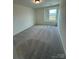 Bright bedroom with plush carpeting and a window offering natural light at 346 Knotty Wood Dr # 71, Monroe, NC 28110