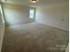 Bedroom featuring neutral carpet and natural light to create a calming atmosphere at 346 Knotty Wood Dr # 71, Monroe, NC 28110