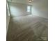 Inviting bedroom offers soft carpeting and a bright window for natural light at 346 Knotty Wood Dr # 71, Monroe, NC 28110