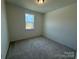 Cozy bedroom features soft carpet, a window with natural light and neutral paint at 346 Knotty Wood Dr # 71, Monroe, NC 28110
