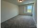 A peaceful bedroom with neutral carpet and natural light, ready for relaxation at 346 Knotty Wood Dr # 71, Monroe, NC 28110