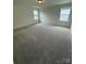 Cozy bedroom offers plush carpeting and a window, perfect for relaxation at 346 Knotty Wood Dr # 71, Monroe, NC 28110