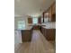 Modern kitchen featuring stainless steel appliances, granite countertops, a central island, and wood-finished cabinets at 346 Knotty Wood Dr # 71, Monroe, NC 28110