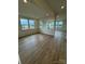 Spacious living room showcasing lots of light, luxury vinyl plank flooring, and an open floorplan at 346 Knotty Wood Dr # 71, Monroe, NC 28110