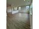New living room with luxury vinyl plank flooring and multiple windows for natural light at 346 Knotty Wood Dr # 71, Monroe, NC 28110