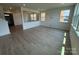 Bright open-concept living area featuring wood floors and large windows overlooking the yard at 346 Knotty Wood Dr # 71, Monroe, NC 28110