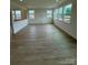 Large living area with luxury vinyl plank flooring and many windows for lots of natural light at 346 Knotty Wood Dr # 71, Monroe, NC 28110