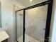 Close-up of a modern glass-enclosed shower with tiled walls and sleek fixtures at 346 Knotty Wood Dr # 71, Monroe, NC 28110