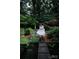 A stunning water feature accents lush backyard landscaping, creating a tranquil retreat at 4313 Kingswood Rd, Charlotte, NC 28226