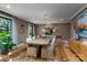 Elegant dining room featuring stylish lighting, hardwood floors, and neutral decor at 4313 Kingswood Rd, Charlotte, NC 28226