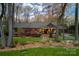Charming exterior with mature trees, professional landscaping, and inviting front entrance at 4313 Kingswood Rd, Charlotte, NC 28226
