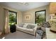 Relaxing living room with ample natural light and views of the lush outdoors at 4313 Kingswood Rd, Charlotte, NC 28226