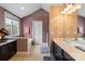 Bathroom featuring a soaking tub, and dual sink vanity, with a separate shower at 6019 Timbertop Ln, Charlotte, NC 28215